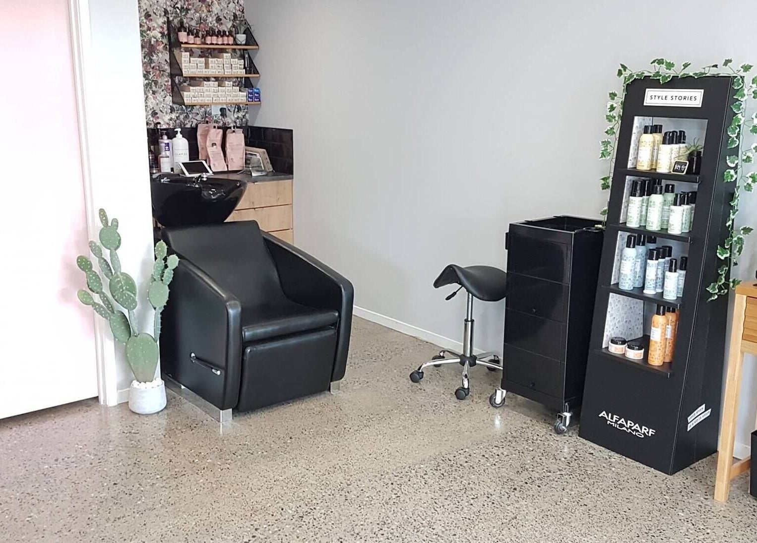 Elegant salon setup at The Ginger Fox, Morrinsville, Waikato, NZ displaying beauty products and styling chair.