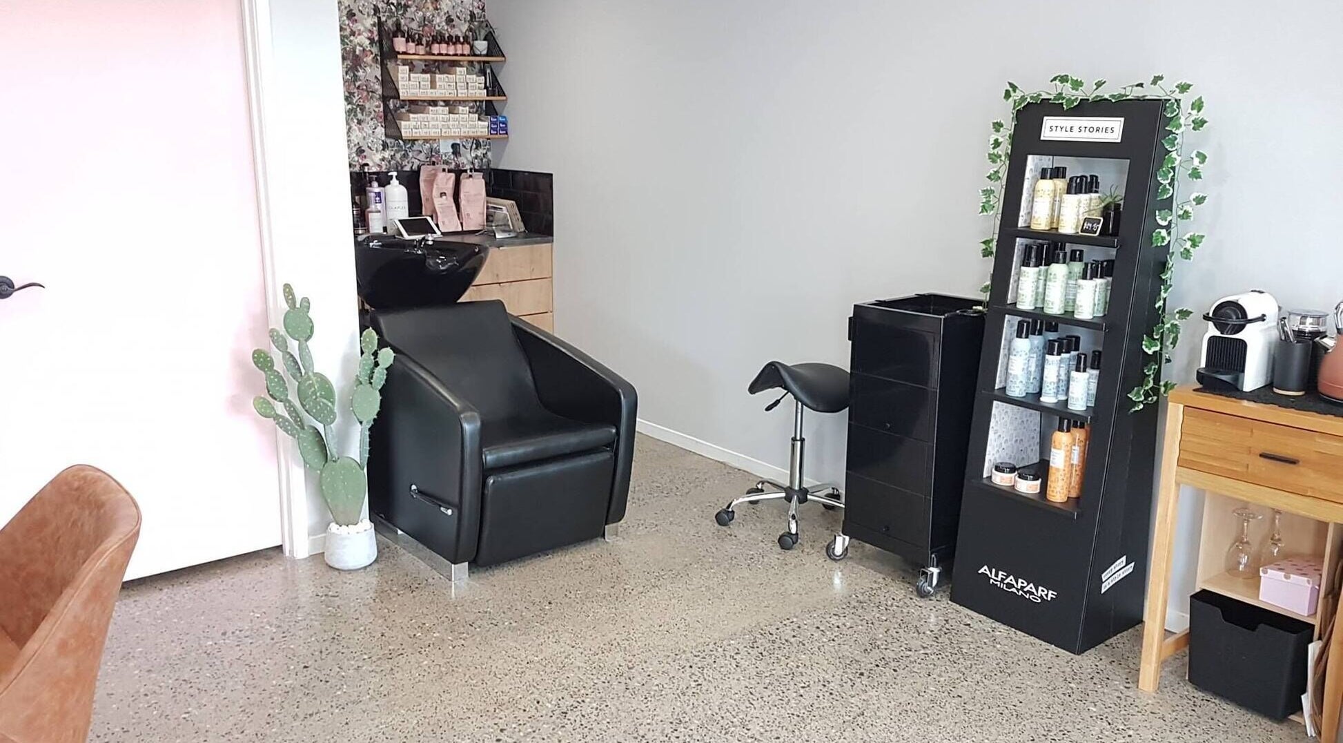 Elegant salon setup at The Ginger Fox, Morrinsville, Waikato, NZ displaying beauty products and styling chair.