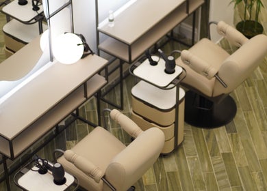 Elegant styling station with beige chairs at Ash Center Salon, Madinah, Al Madinah Province, SA.