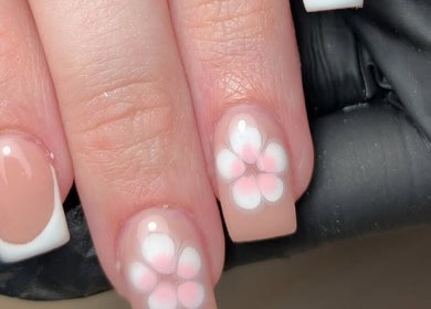 Floral nail art design at CXM Nails, Bangor, Northern Ireland, GB. Elegant pink and white flower accents.
