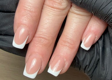 Elegant French manicure at CXM Nails, Bangor, Northern Ireland, GB. Perfect blend of style and sophistication.