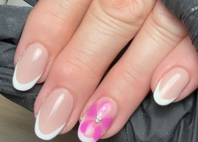 Elegant pink and white French manicure with flower at CXM Nails, Bangor, Northern Ireland, GB.