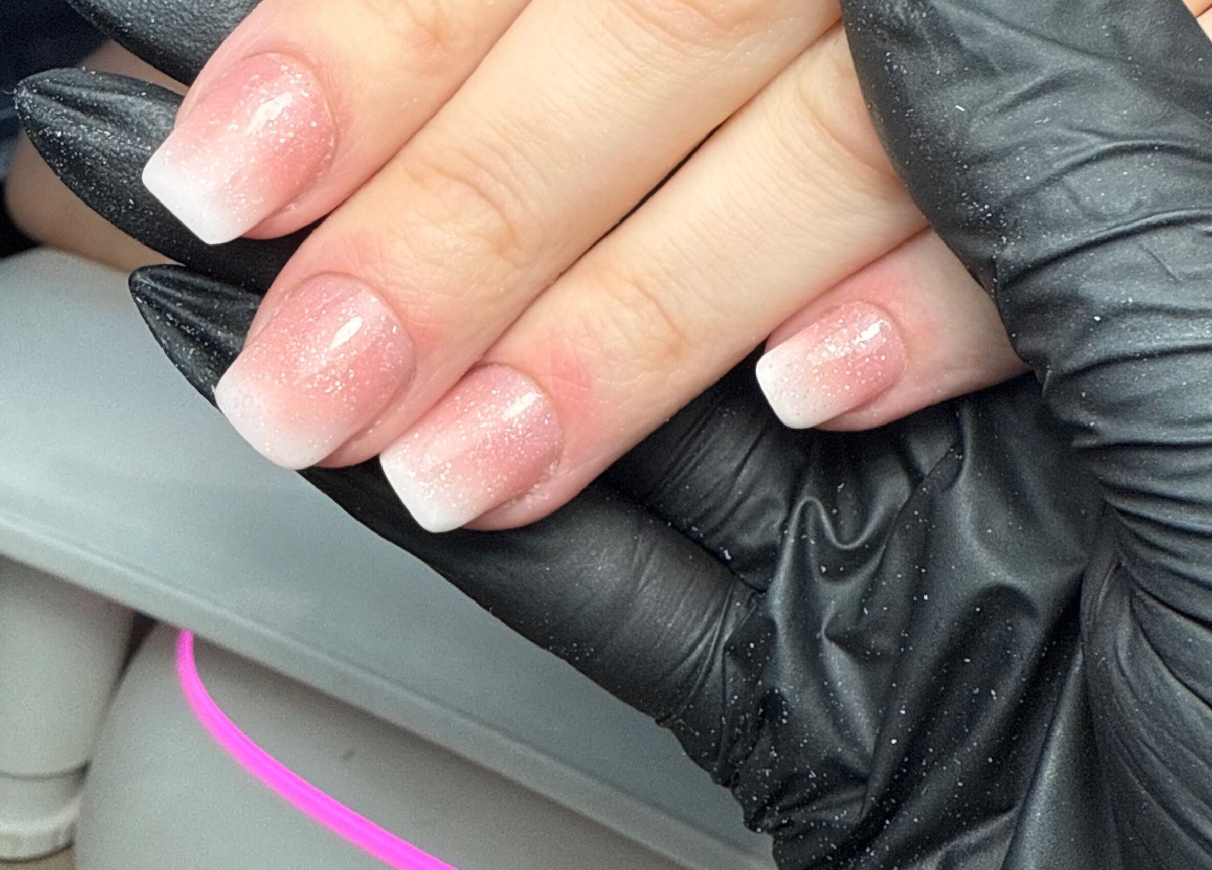 Elegant glitter ombre nails at CXM Nails, Bangor, Northern Ireland, GB. Perfect for a chic manicure.