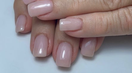 Glossy pink nails by Xio’S Nails in Greensboro, North Carolina, US, showcasing expert nail care.