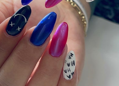 Colorful nail art at Xio’s Nails in Greensboro, North Carolina, US. Features vibrant designs and colors.