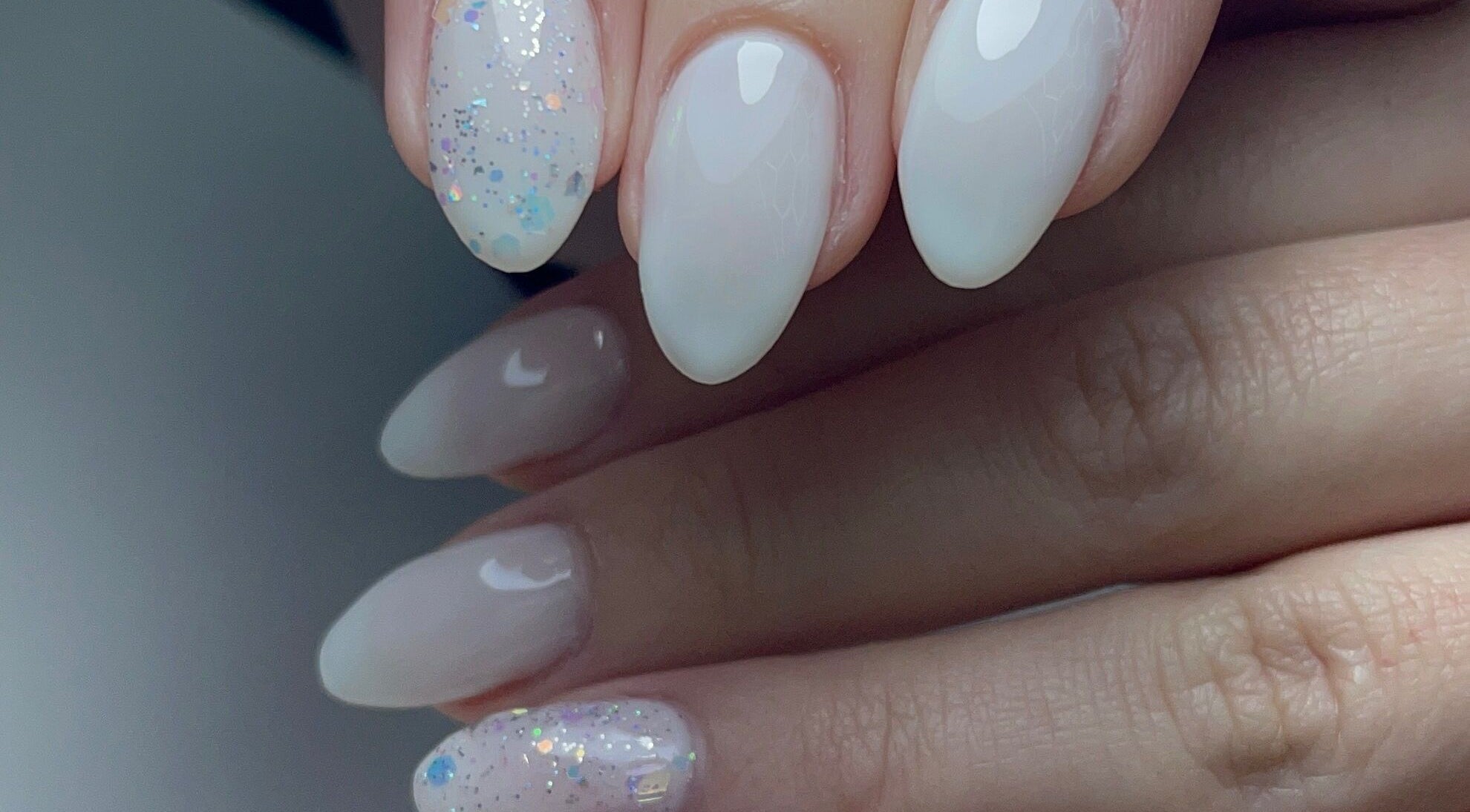 Elegant glitter-accented nails at Xio’s Nails in Greensboro, North Carolina, US.