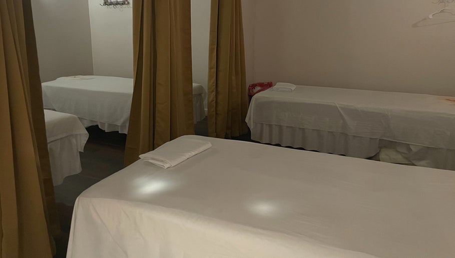 Relaxing massage beds with curtains at Ancient Thai Massage, Los Angeles, California, US.