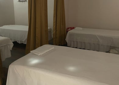 Relaxing massage beds with curtains at Ancient Thai Massage, Los Angeles, California, US.