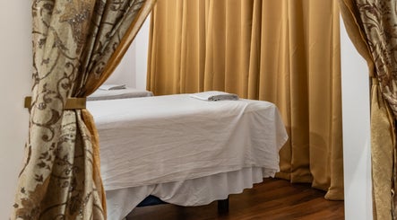 Tranquil massage room at Ancient Thai Massage in Los Angeles, California, US with elegant decor.