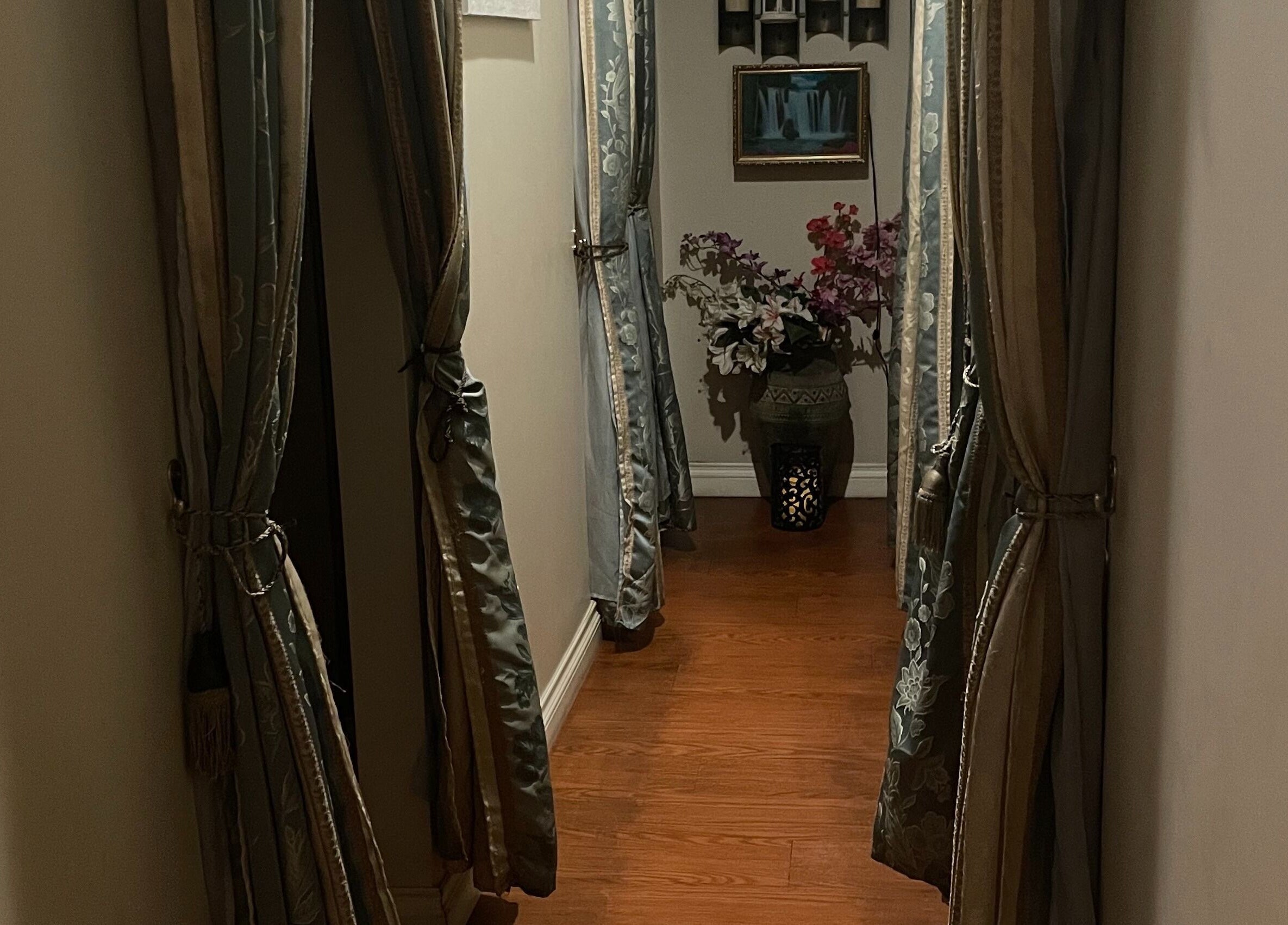 Peaceful hallway with elegant curtains at Ancient Thai Massage, Los Angeles, California, US.