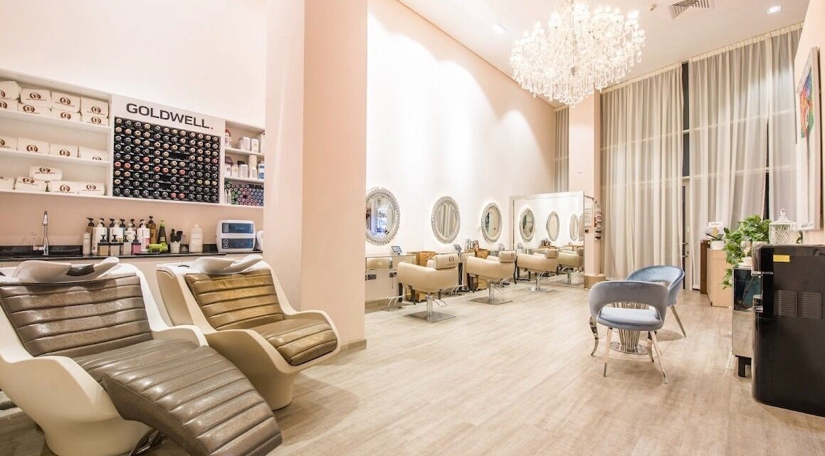 Elegant interior of Just One Beauty salon in Dubai, Dubai, AE with plush chairs and ambient lighting.
