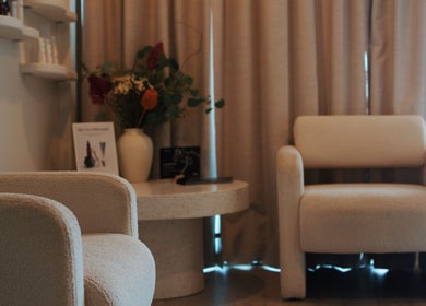 Elesay's cozy lounge with plush chairs and floral decor in Mackay, Queensland, AU.