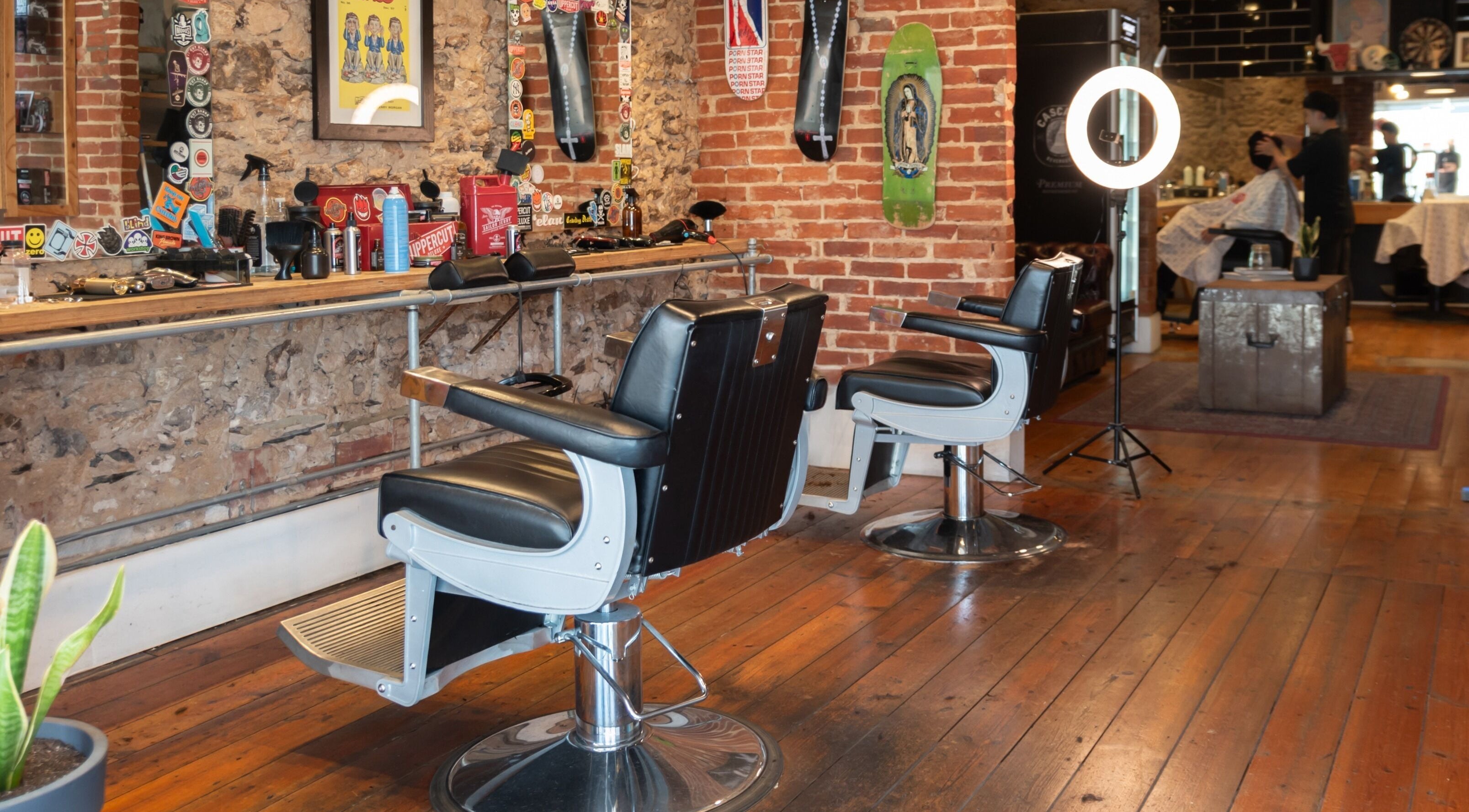 Cozy interior of Cut Snake Barbershop - Glenelg with vintage barber chairs in Glenelg, South Australia, AU.