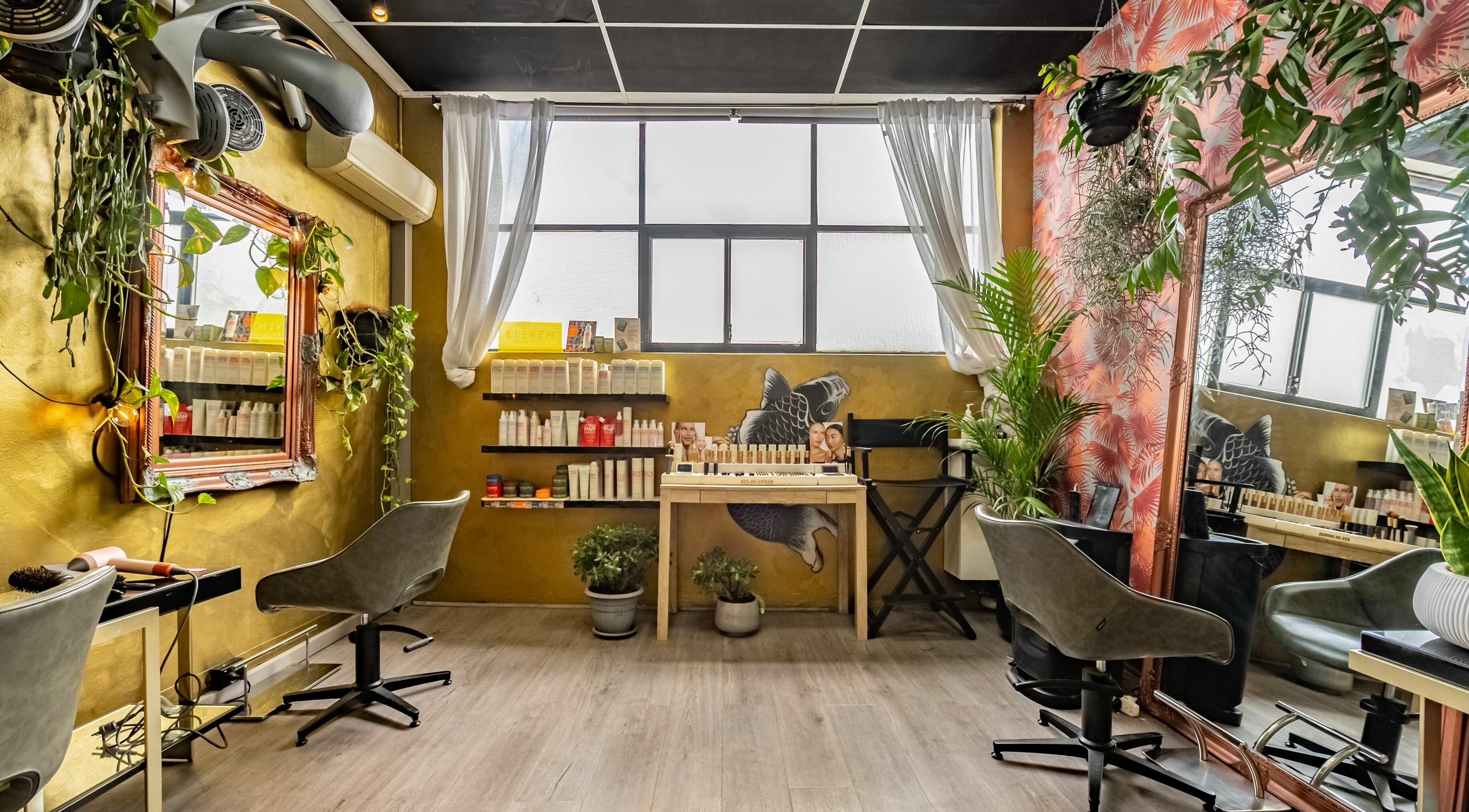 Public Hair Studio's chic interior with styling stations and vibrant decor in Brookvale, NSW, AU.