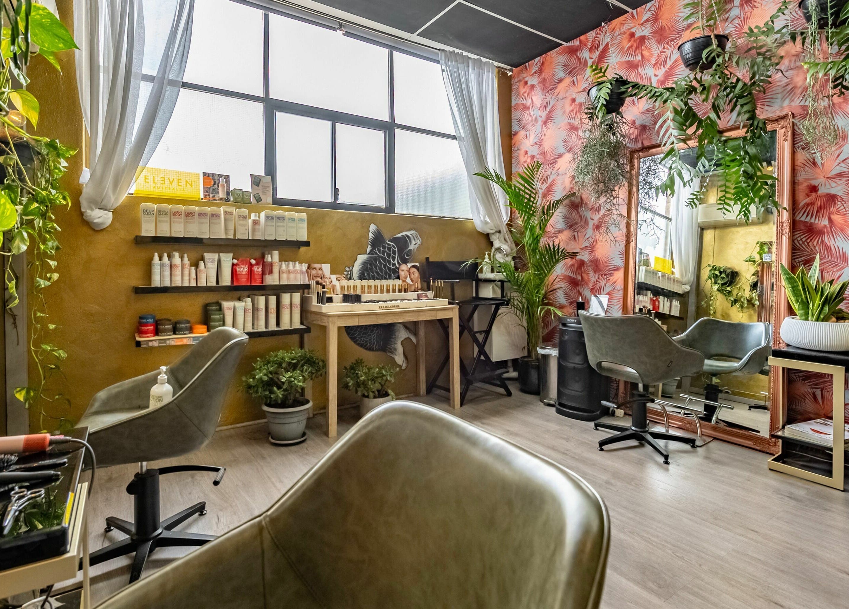 Interior of Public Hair Studio in Brookvale, NSW, AU featuring lush plants and stylish decor.