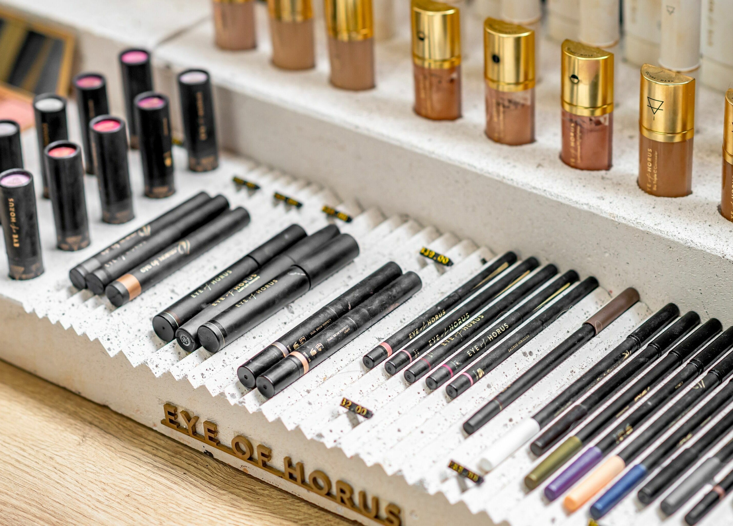 Cosmetic display at Public Hair Studio, Brookvale, NSW, AU showcasing vibrant makeup selection.