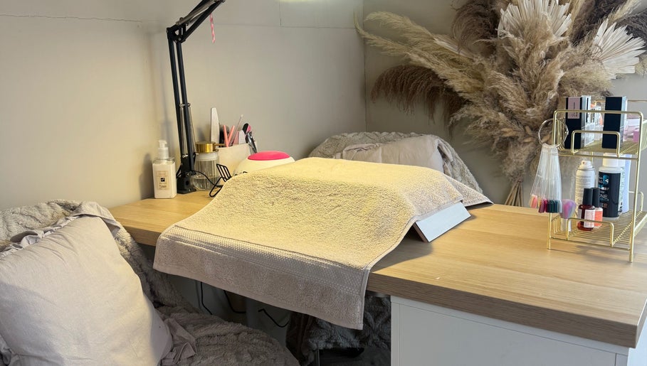 Manicure station at JMCnailsalon, Yeovil, England, GB, featuring a plush chair and organized nail tools.