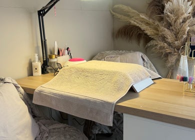 Manicure station at JMCnailsalon, Yeovil, England, GB, featuring a plush chair and organized nail tools.