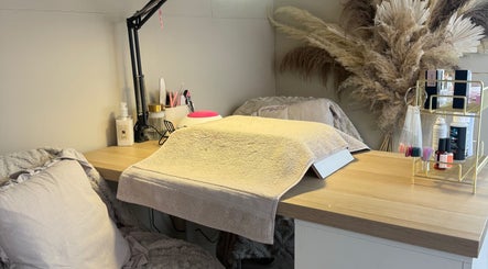 Manicure station at JMCnailsalon, Yeovil, England, GB, featuring a plush chair and organized nail tools.