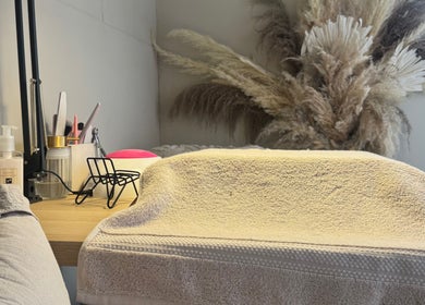 Manicure station at JMCnailsalon, Yeovil, England, GB features tools and decor for a calming experience.