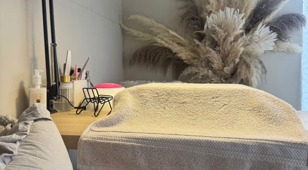 Manicure station at JMCnailsalon, Yeovil, England, GB features tools and decor for a calming experience.