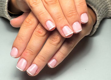 French manicure at JMCnailsalon, Yeovil, England, GB showcasing classic elegance and style.