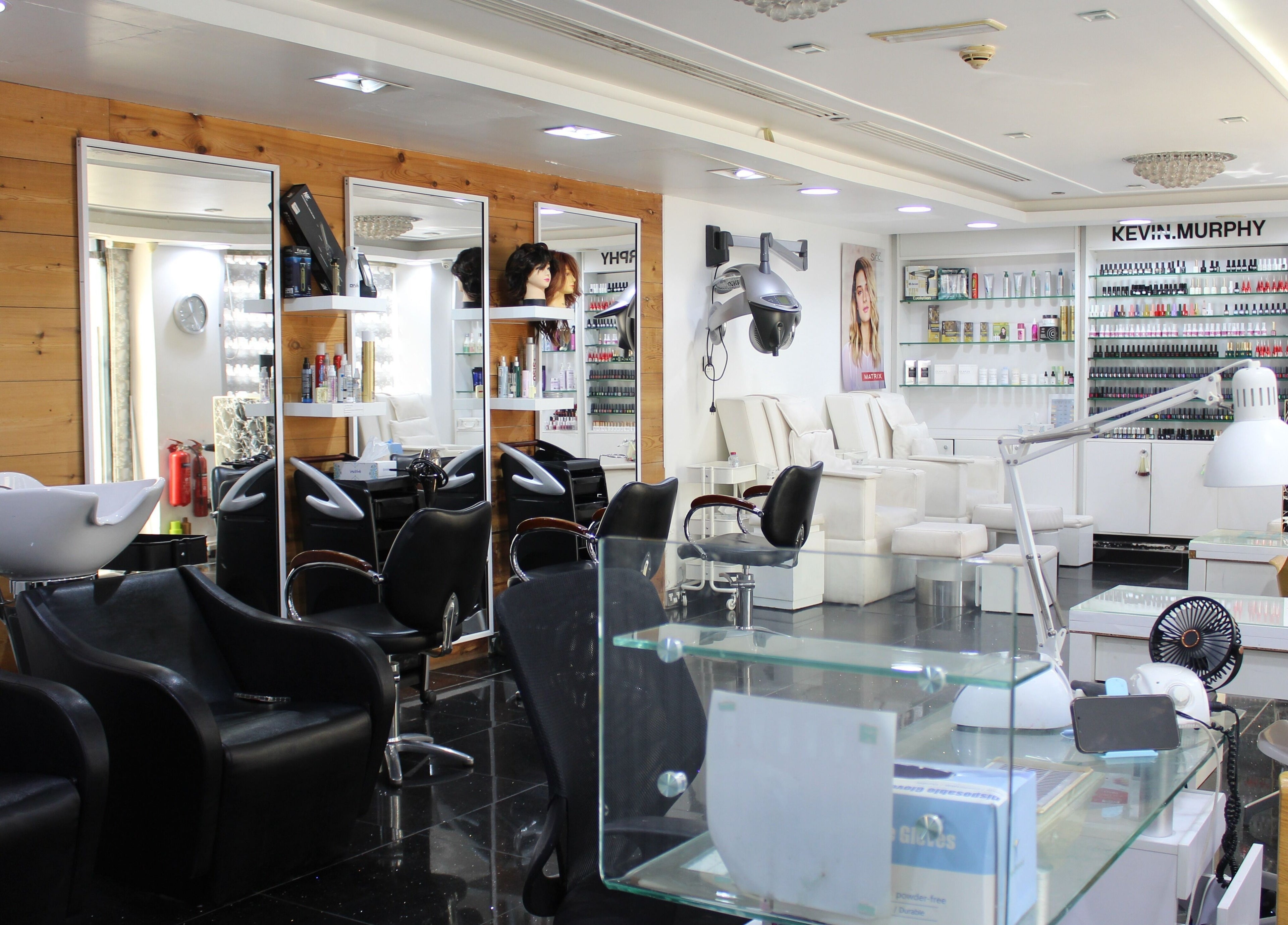 Elegant interior of Black & White Salon in Dubai, Dubai, AE, showcasing modern salon stations and beauty products.