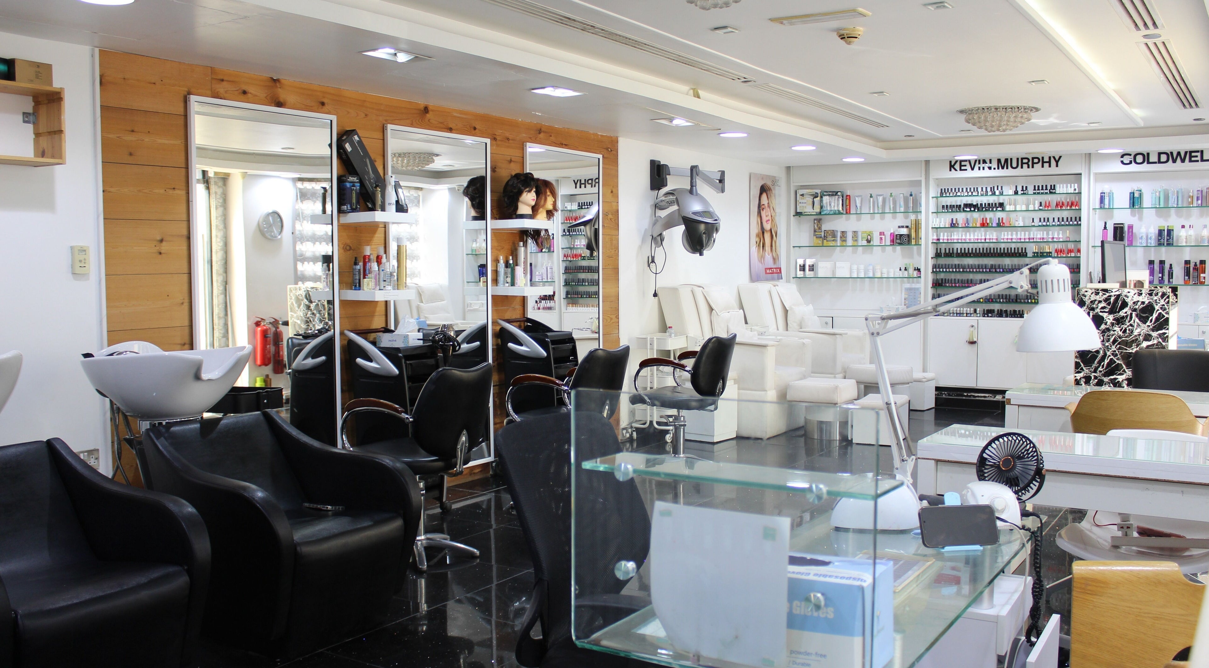 Elegant interior of Black & White Salon in Dubai, Dubai, AE, showcasing modern salon stations and beauty products.