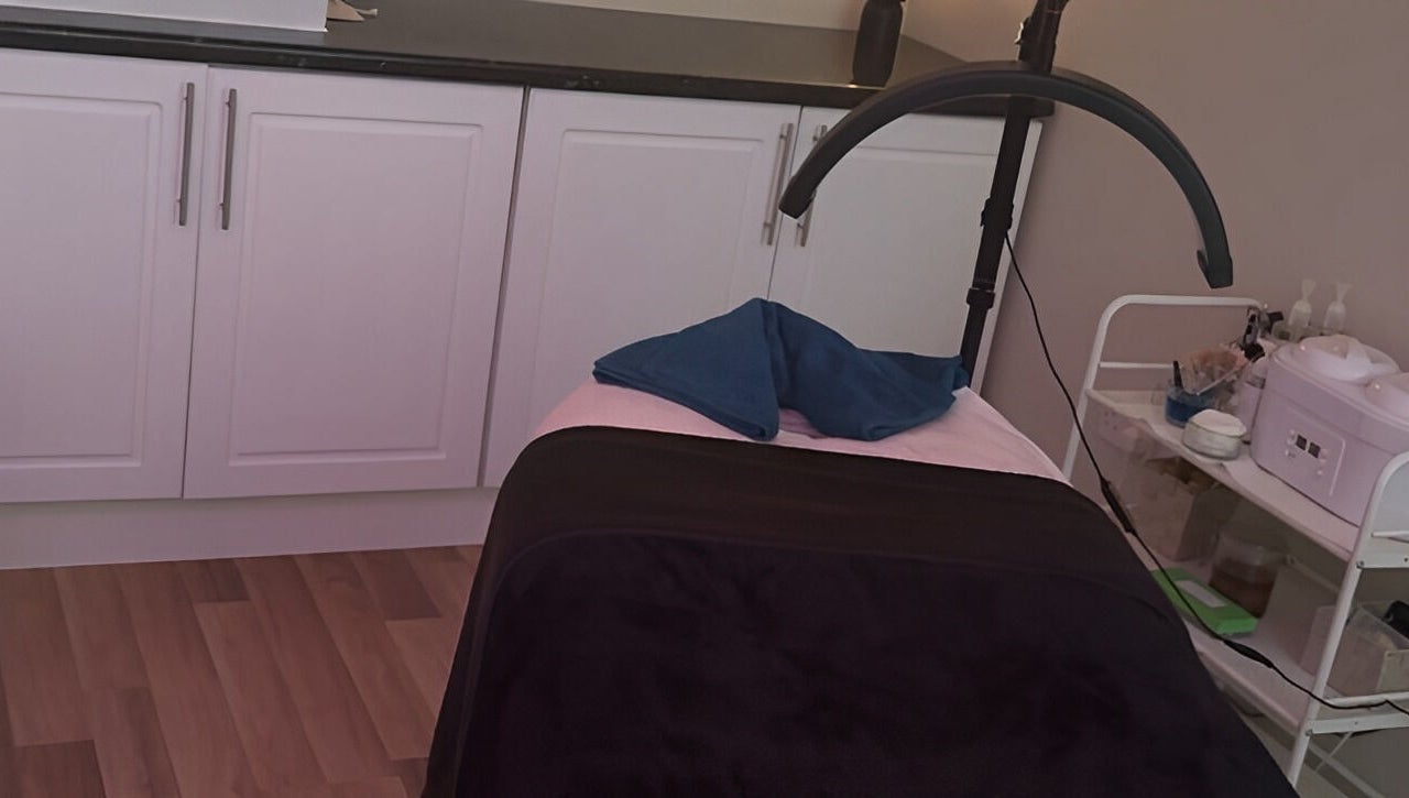 Treatment room at Beauty by Lisa, Alva, Scotland, GB, featuring a massage bed and soothing decor.