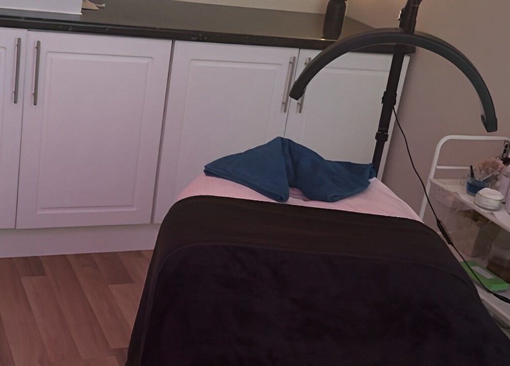 Treatment room at Beauty by Lisa, Alva, Scotland, GB, featuring a massage bed and soothing decor.