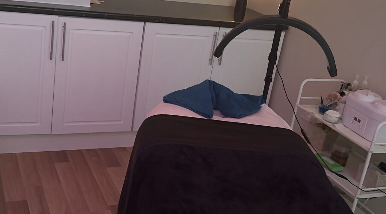 Treatment room at Beauty by Lisa, Alva, Scotland, GB, featuring a massage bed and soothing decor.