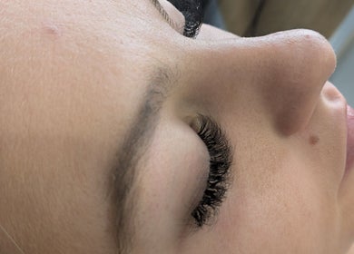 Close-up of a woman receiving eyelash extensions at Beauty by Kimberley, Dollar, Scotland, GB.
