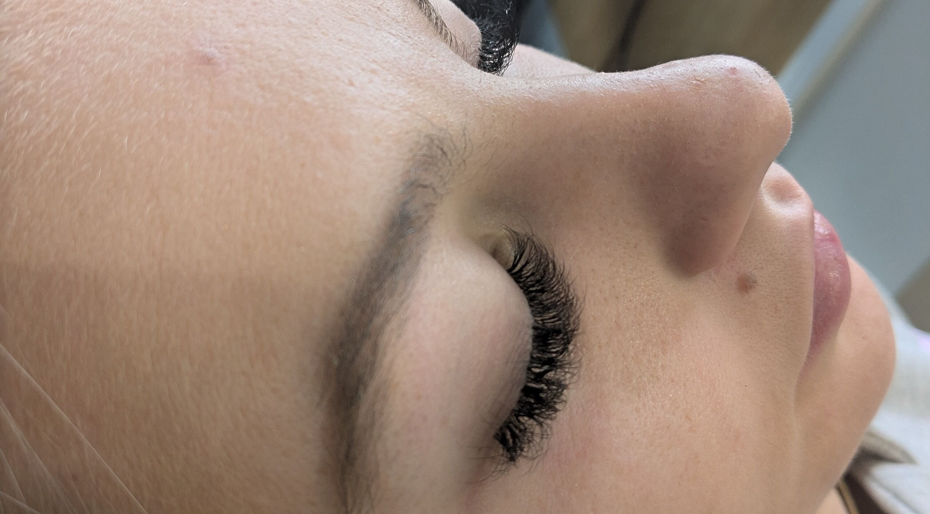 Close-up of a woman receiving eyelash extensions at Beauty by Kimberley, Dollar, Scotland, GB.