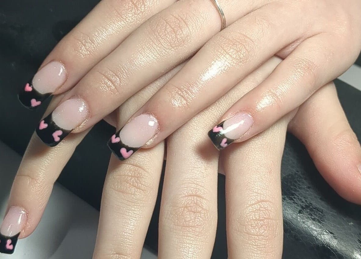 Stylish black nails with pink hearts at Beauty by Kimberley, Dollar, Scotland, GB.