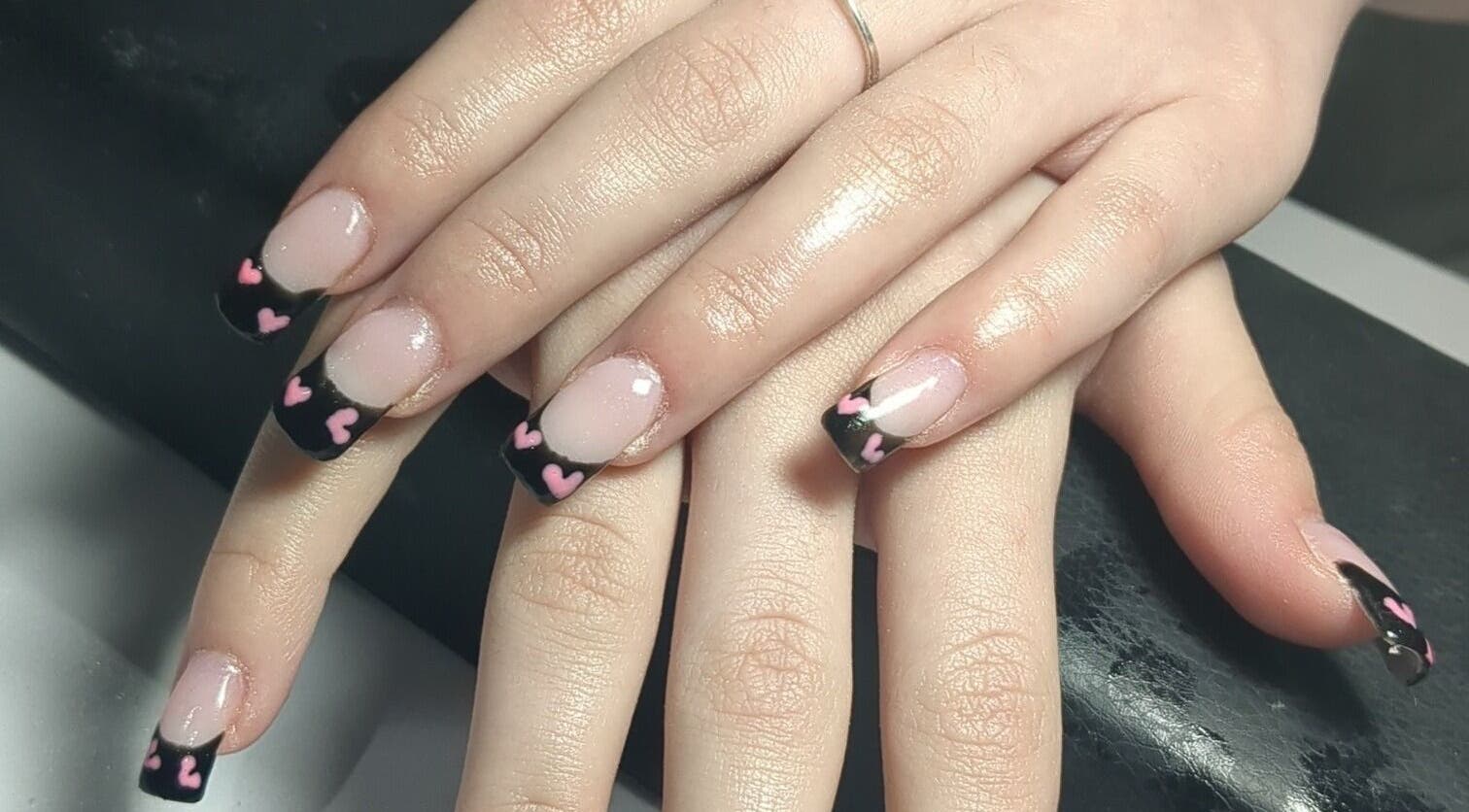 Stylish black nails with pink hearts at Beauty by Kimberley, Dollar, Scotland, GB.