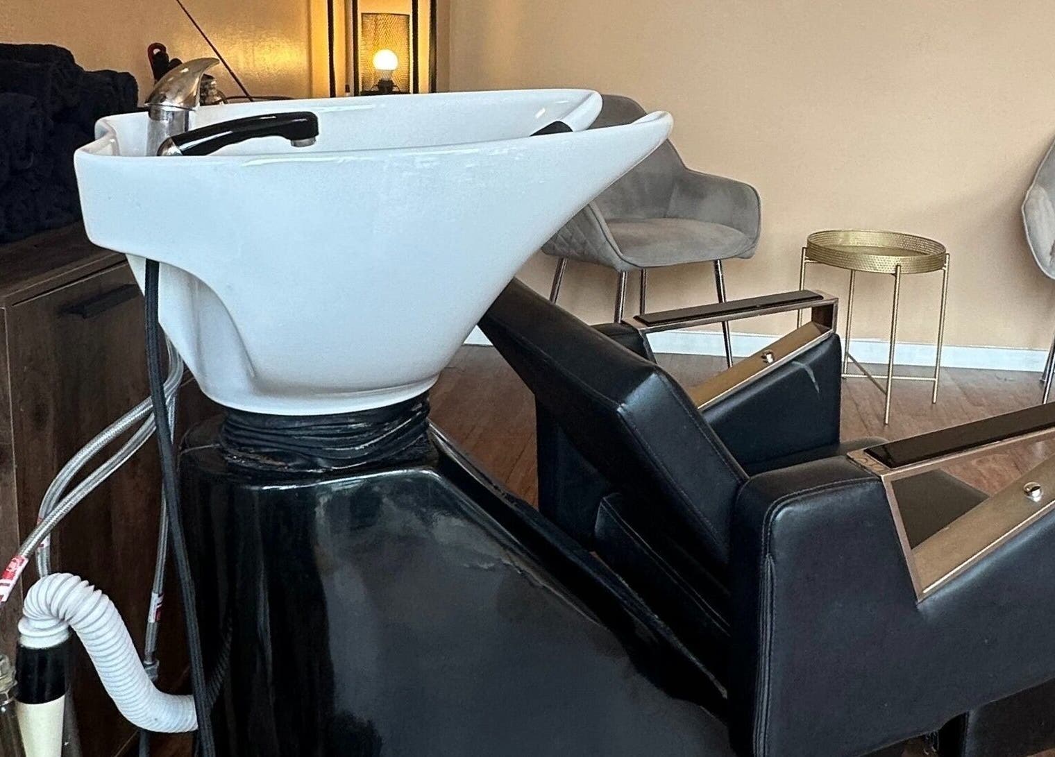 Modern hair washing station at Hello Gorgeous Hairdressing, London, England, GB.