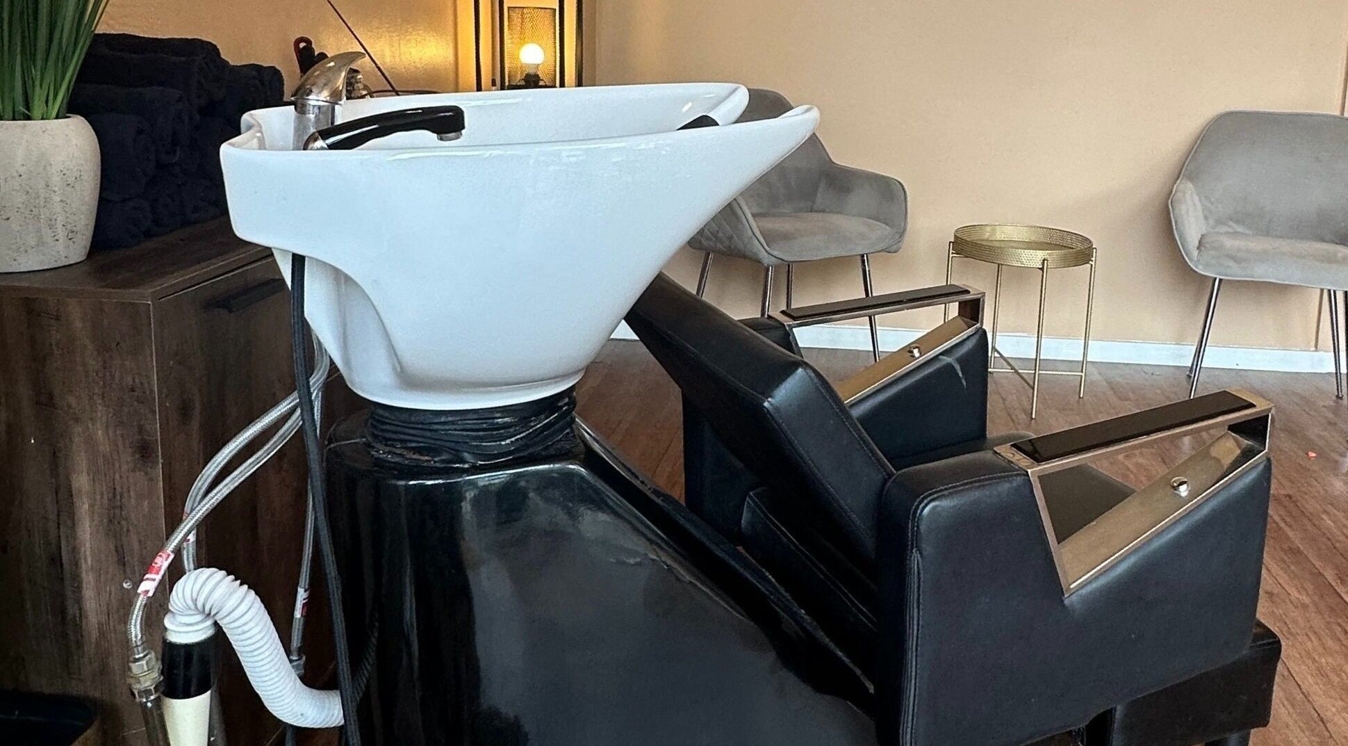 Modern hair washing station at Hello Gorgeous Hairdressing, London, England, GB.