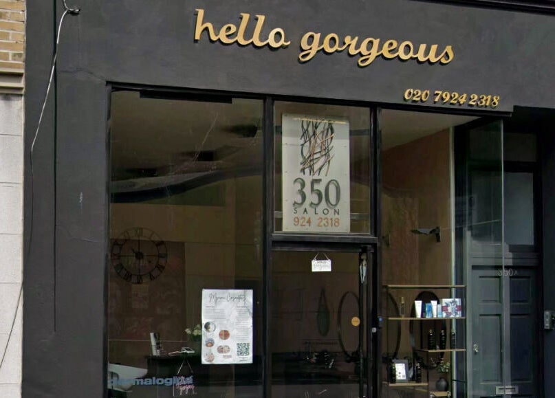 Exterior view of Hello Gorgeous Hairdressing located in London, England, GB, showcasing its elegant signage.