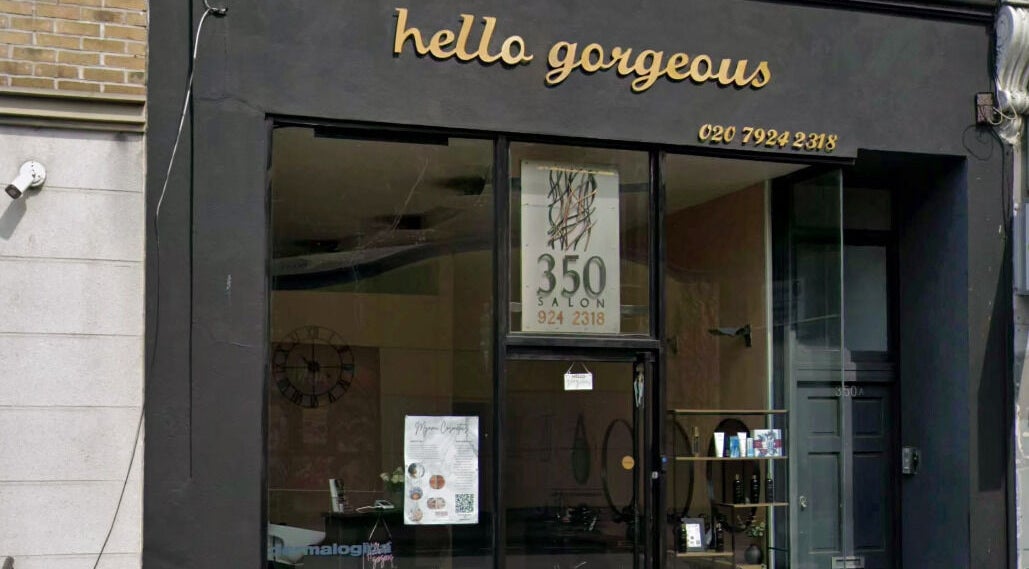 Exterior view of Hello Gorgeous Hairdressing located in London, England, GB, showcasing its elegant signage.