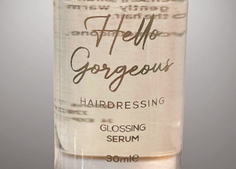 Hello Gorgeous Hairdressing glossing serum bottle from London, England, GB, reflecting salon elegance.