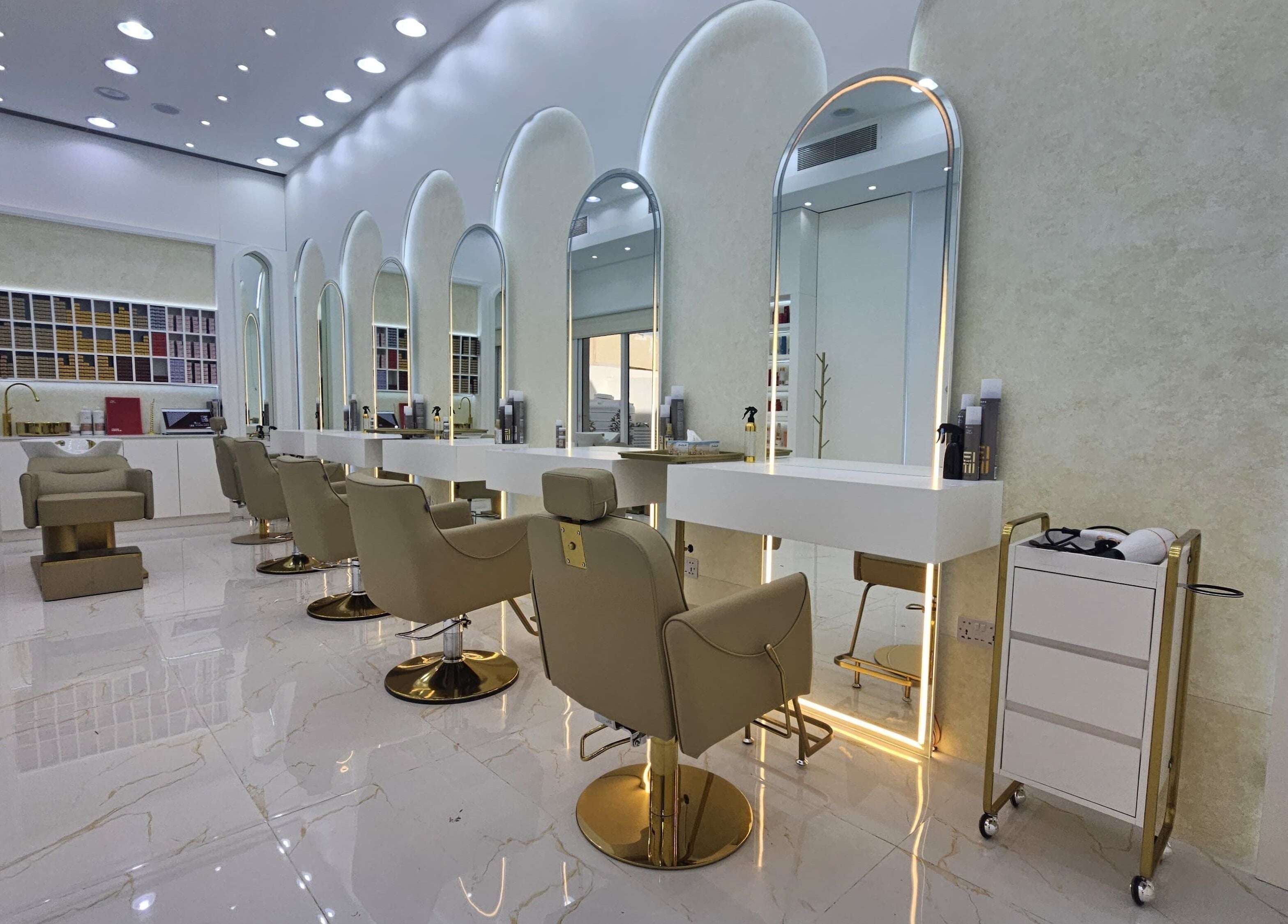 Modern interior at Azalea Beauty Center, Sharjah, Sharjah, AE with sleek salon chairs and illuminated mirrors.