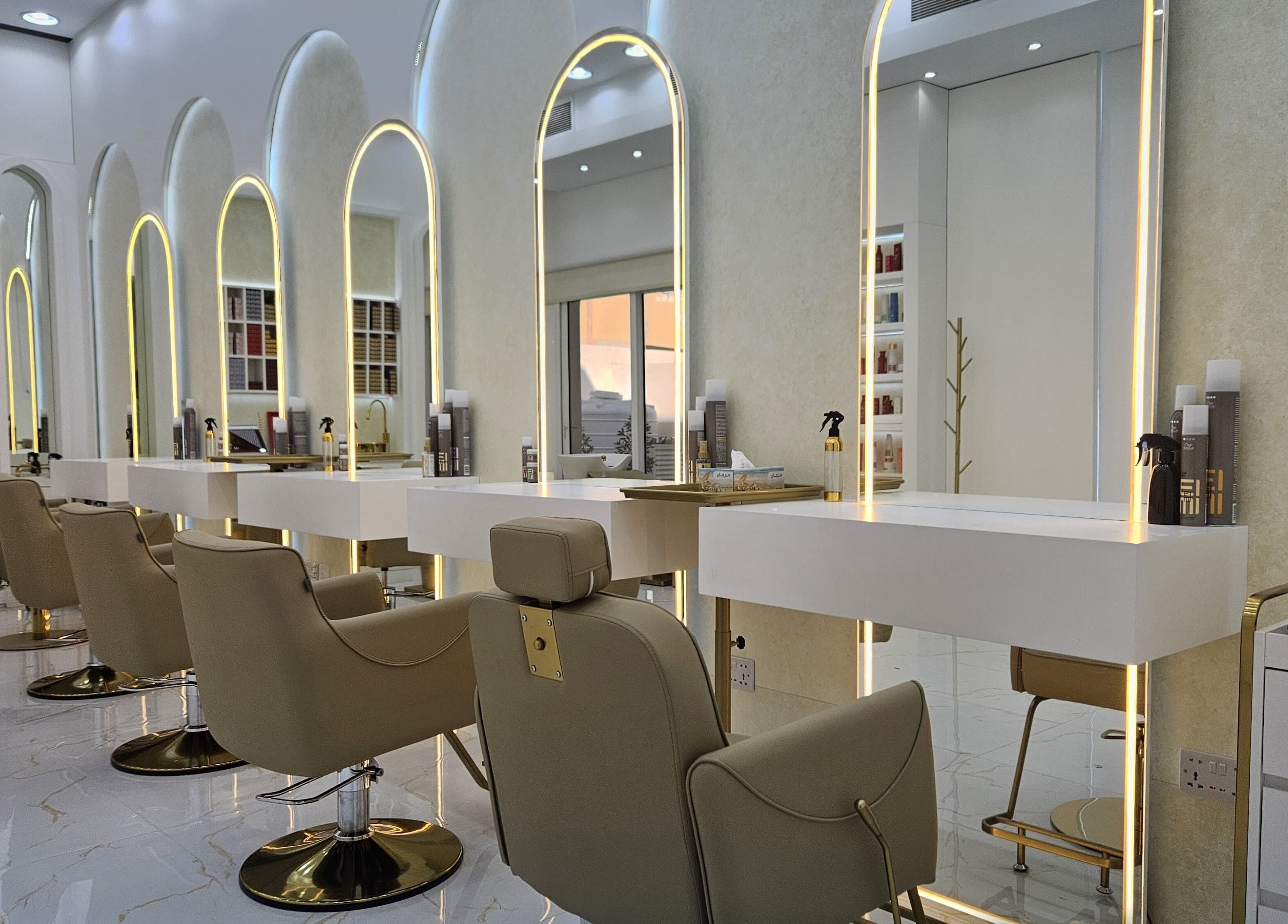 Elegant salon interior with lighted mirrors at Azalea Beauty Center in Sharjah, Sharjah, AE.