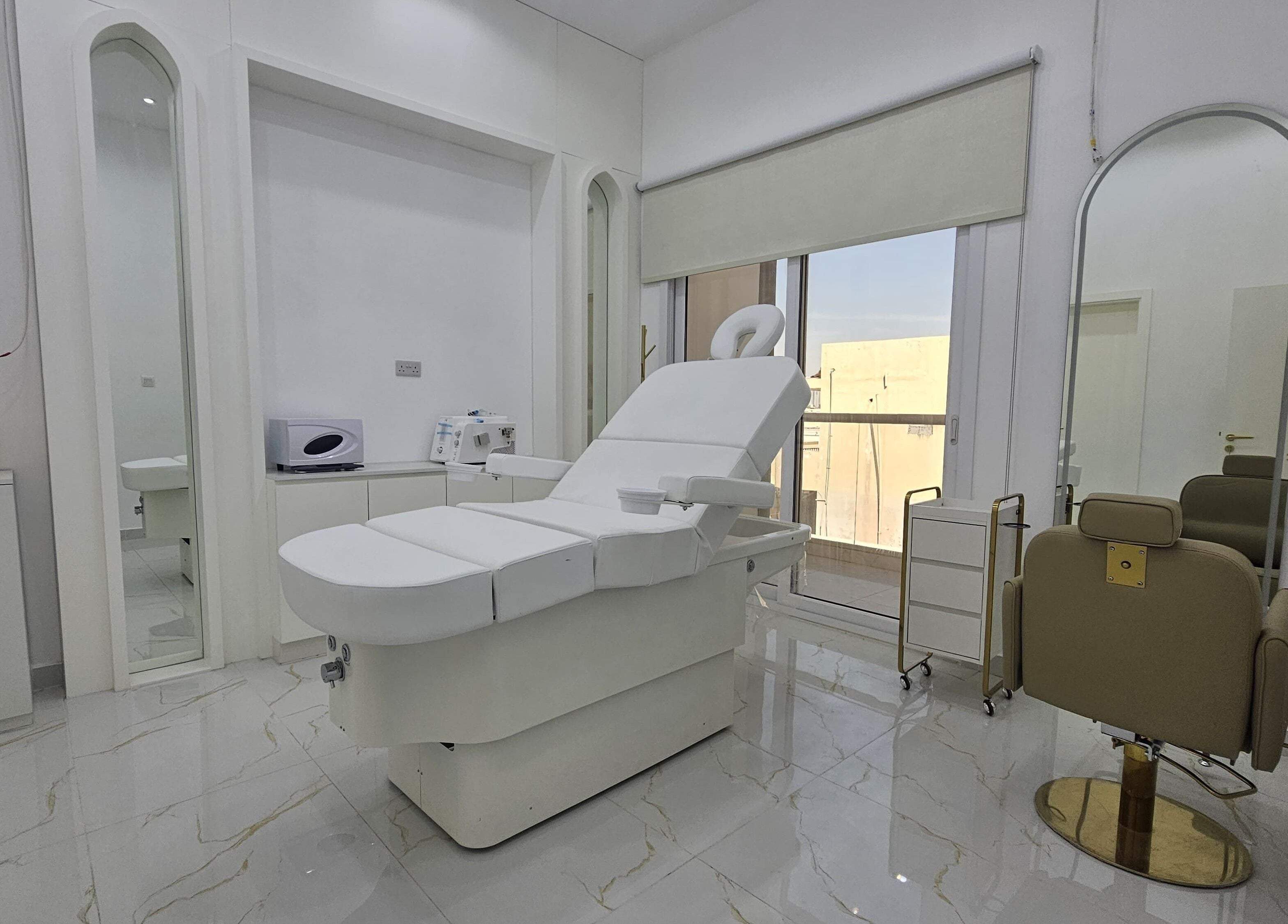 Luxurious treatment room at Azalea Beauty Center, Sharjah, Sharjah, AE with modern decor and spa chair.