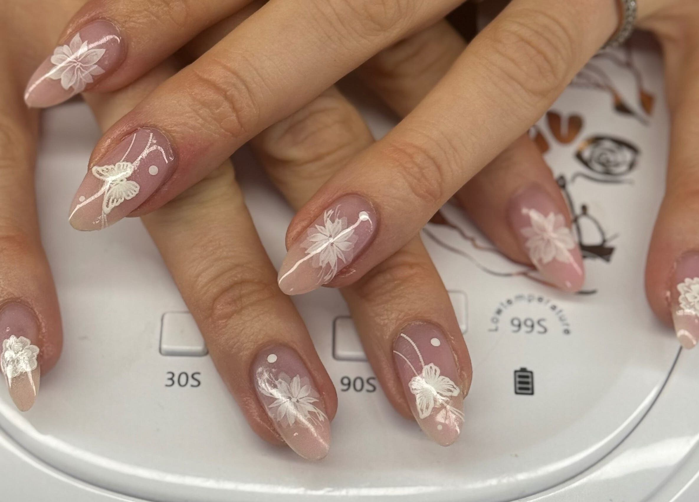 Intricate floral nail art at Ultimate Sass Nails, East Leake, England, GB.