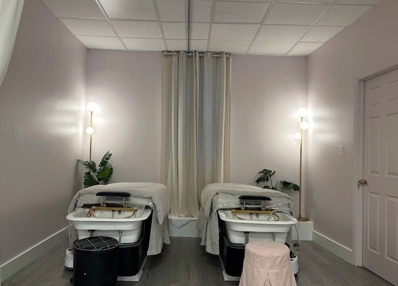 Relaxing spa room at Le Beauty in New York, New York, US, featuring cozy beds and soft lighting.