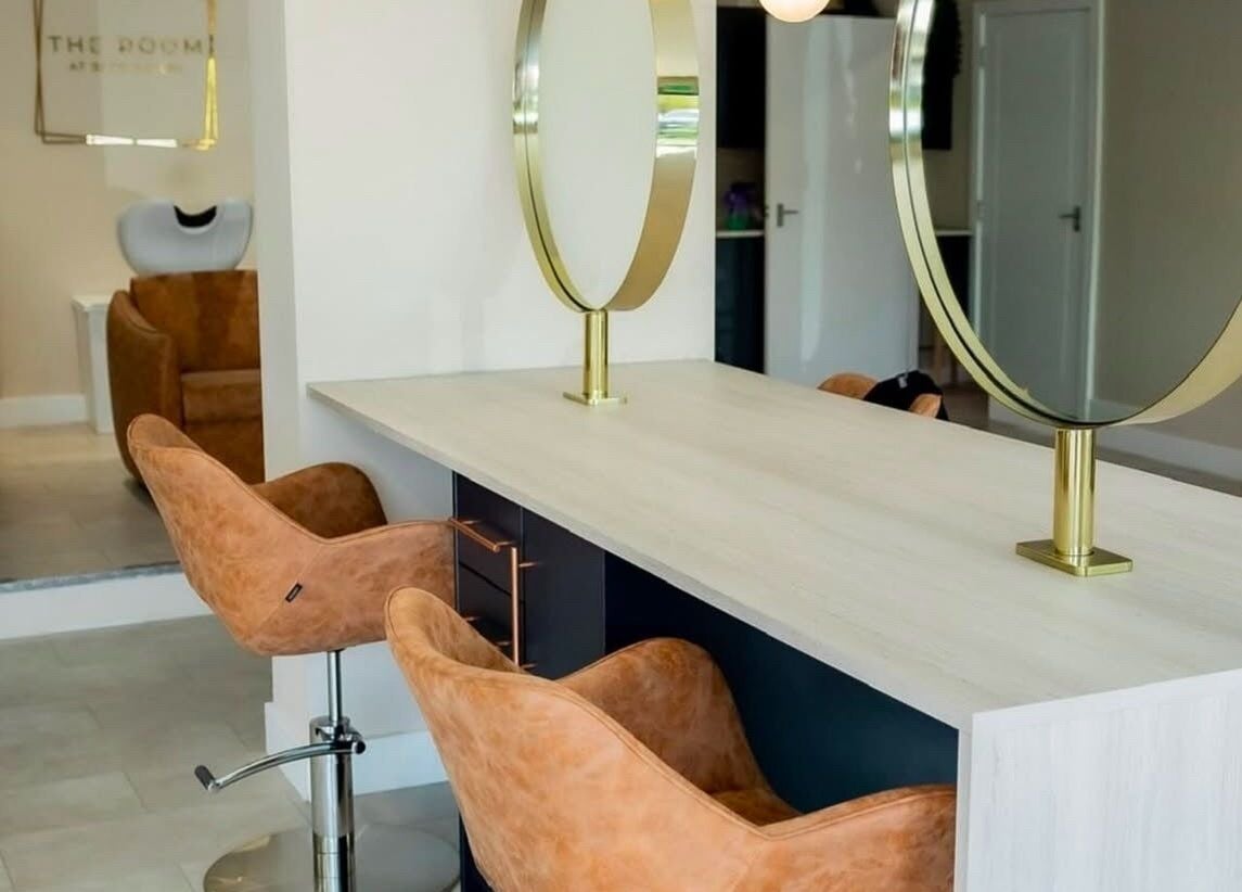 Modern salon chairs and mirrors at Stephanie Smith Hair in Aylesbury, England, GB.