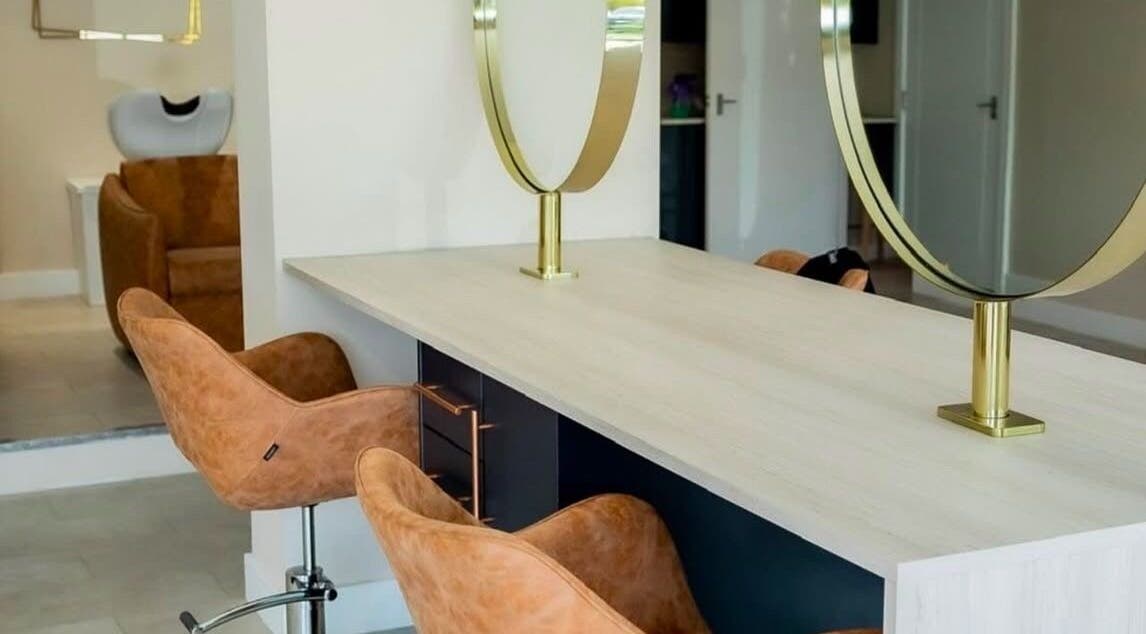 Modern salon chairs and mirrors at Stephanie Smith Hair in Aylesbury, England, GB.