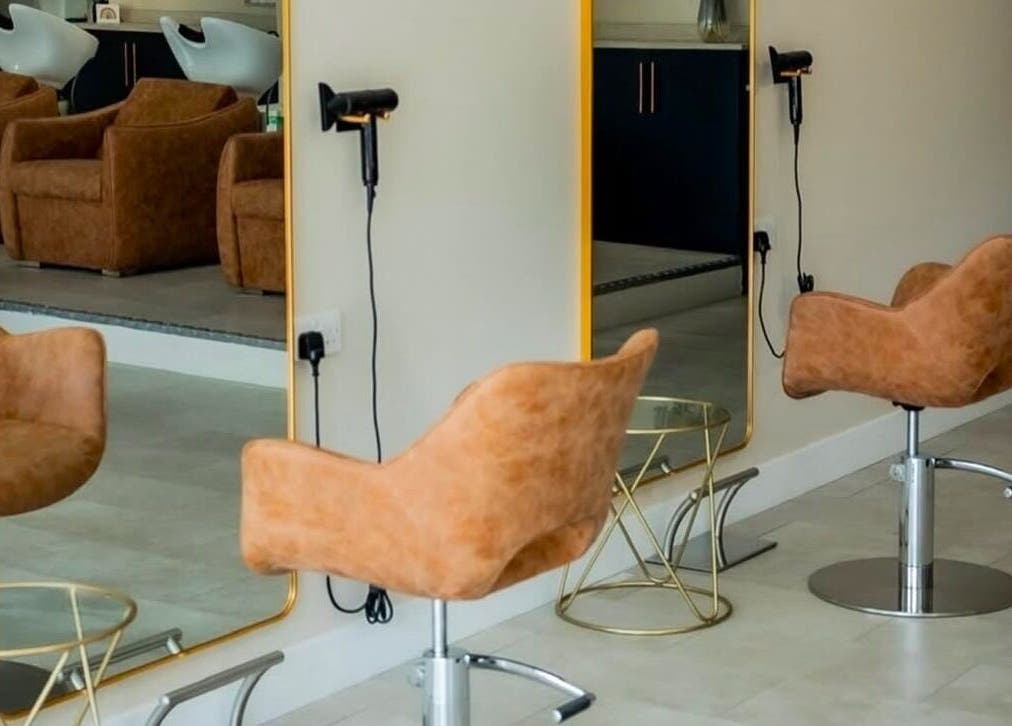 Modern salon interior with stylish chairs and mirrors at Stephanie Smith Hair, Aylesbury, England, GB.