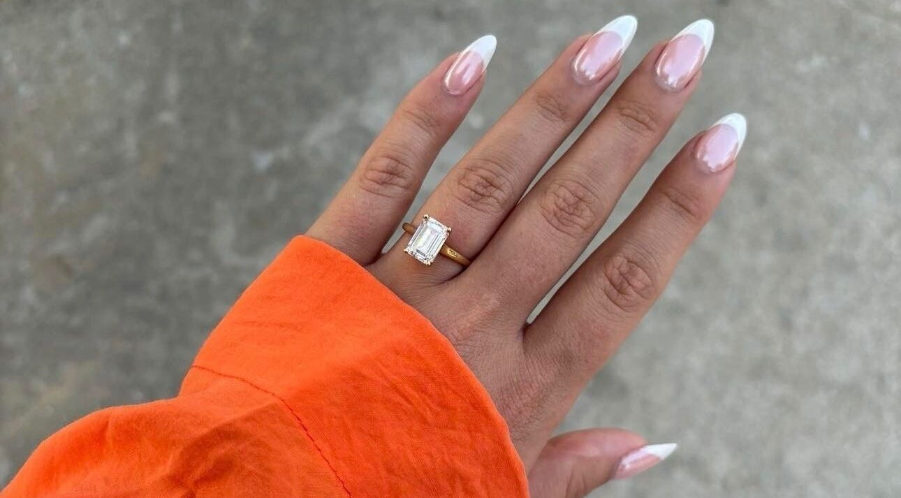 Close-up of elegant French manicure with ring at Nails by Chloe, Glasgow, Scotland, GB.