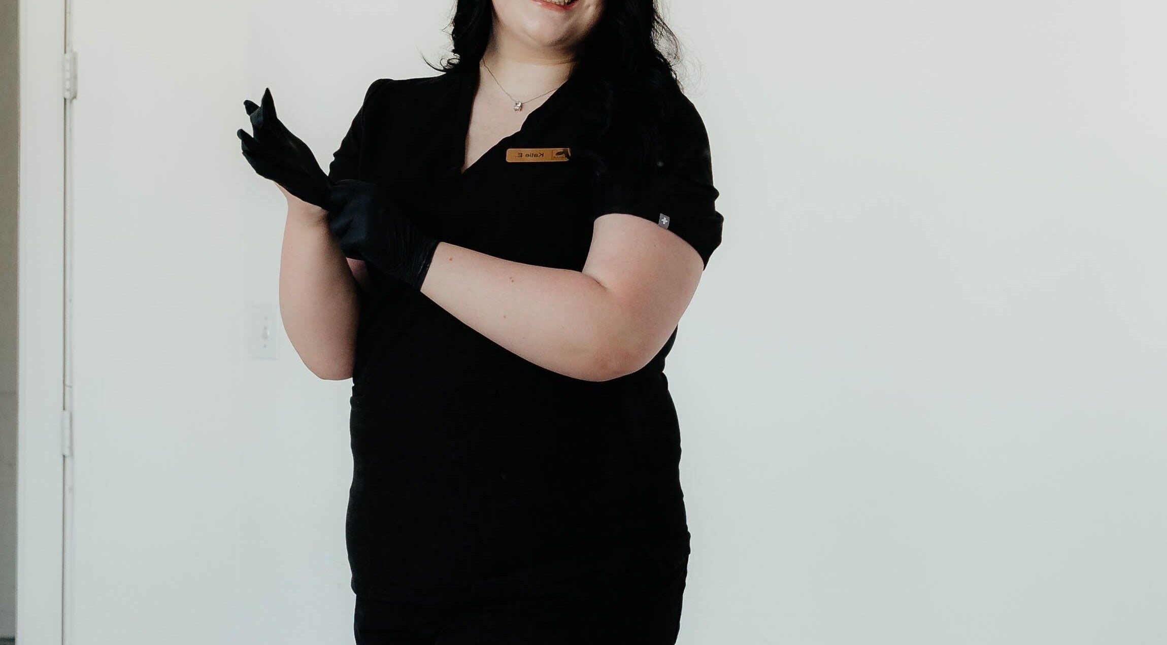 Professional at Your Esti Katie Utah in South Jordan, Utah, US, wearing black gloves and smiling.